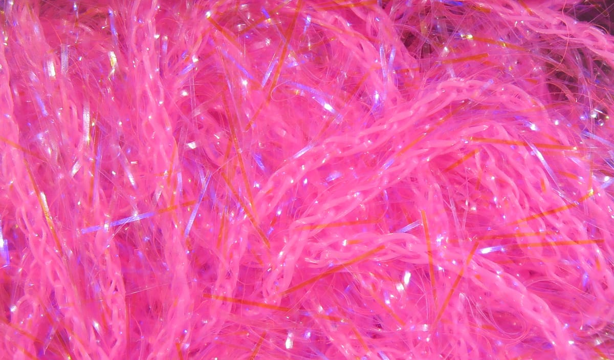Bright neon pink Hareline UV polar chenille with iridescent tinsel strands and fluffy braided fibers
