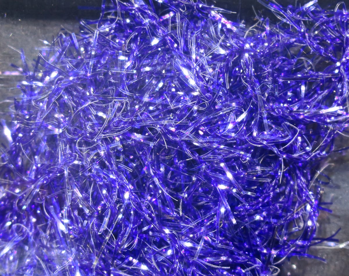 Vibrant purple UV polar chenille with iridescent tinsel fibers and fuzzy strands for fly tying