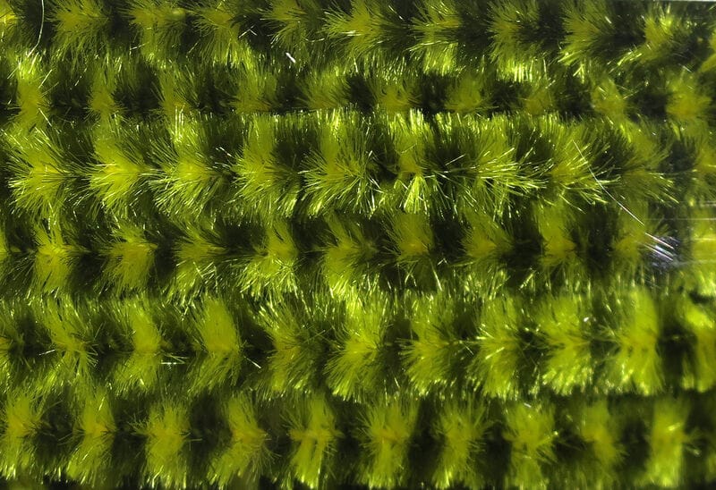 Hareline variegated chenille in olive-yellow and black barred fuzzy fibers for fly tying