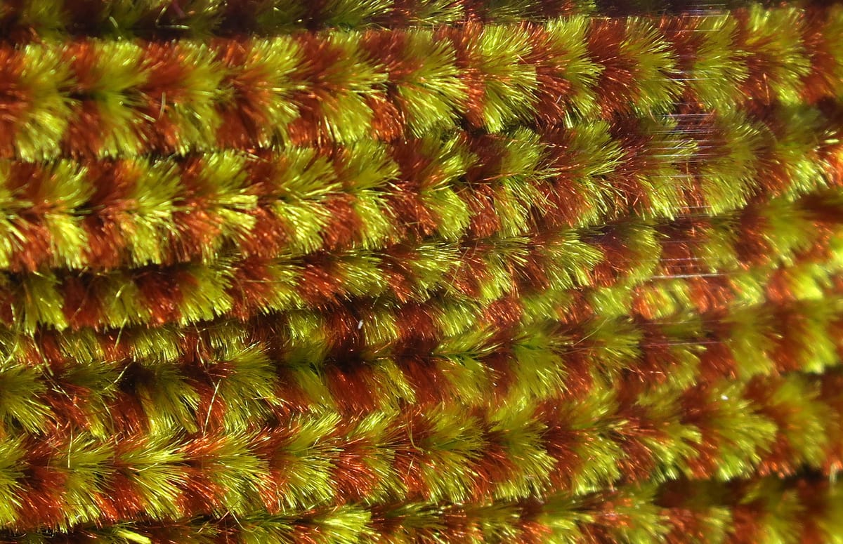 Variegated chenille for fly tying, lime green and copper fuzzy iridescent strands with dense, plush texture