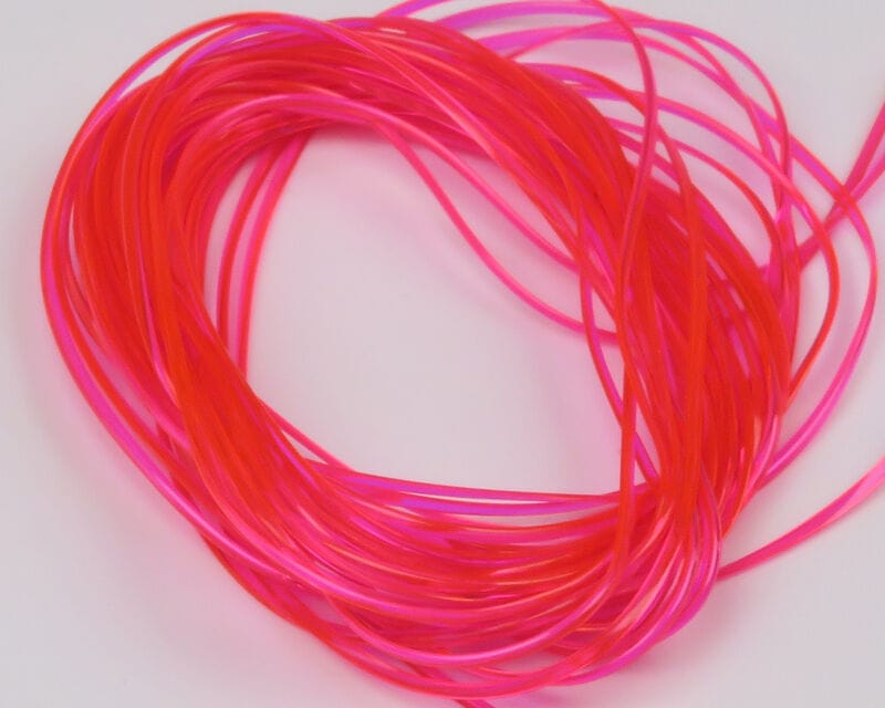 Hareline Vinyl Rib fly tying material, coiled translucent neon pink-red vinyl strands used for ribbing