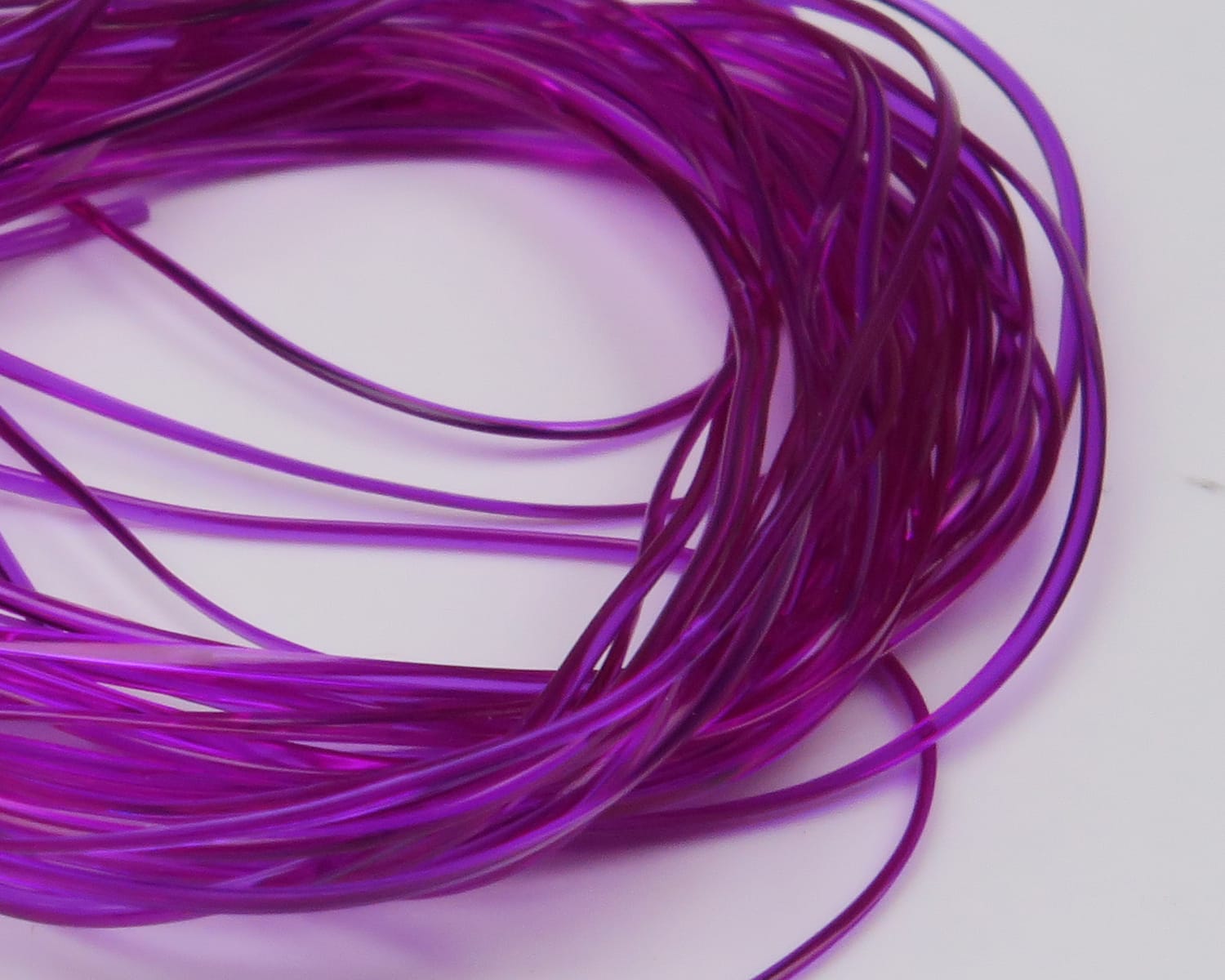 Hareline purple translucent vinyl rib coiled strands, thin flexible tubing for fly tying