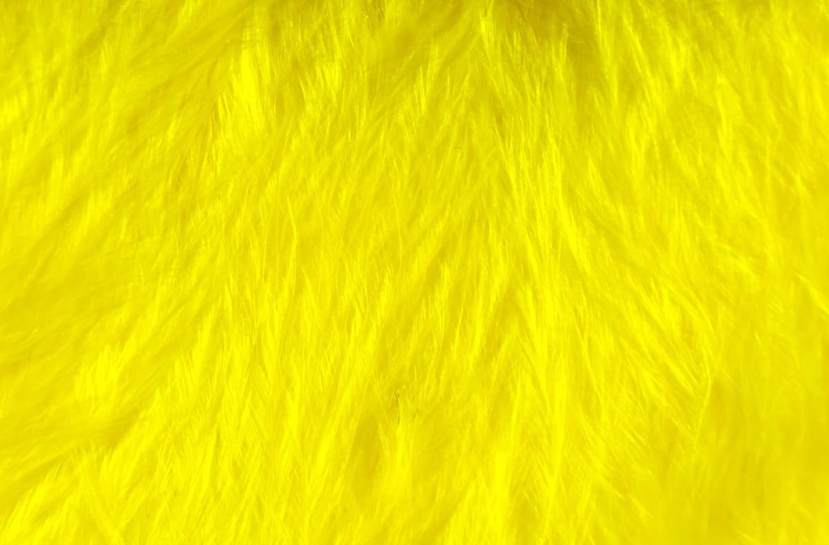Bright yellow Hareline Woolly Bugger marabou feathers, soft fluffy texture for fly tying
