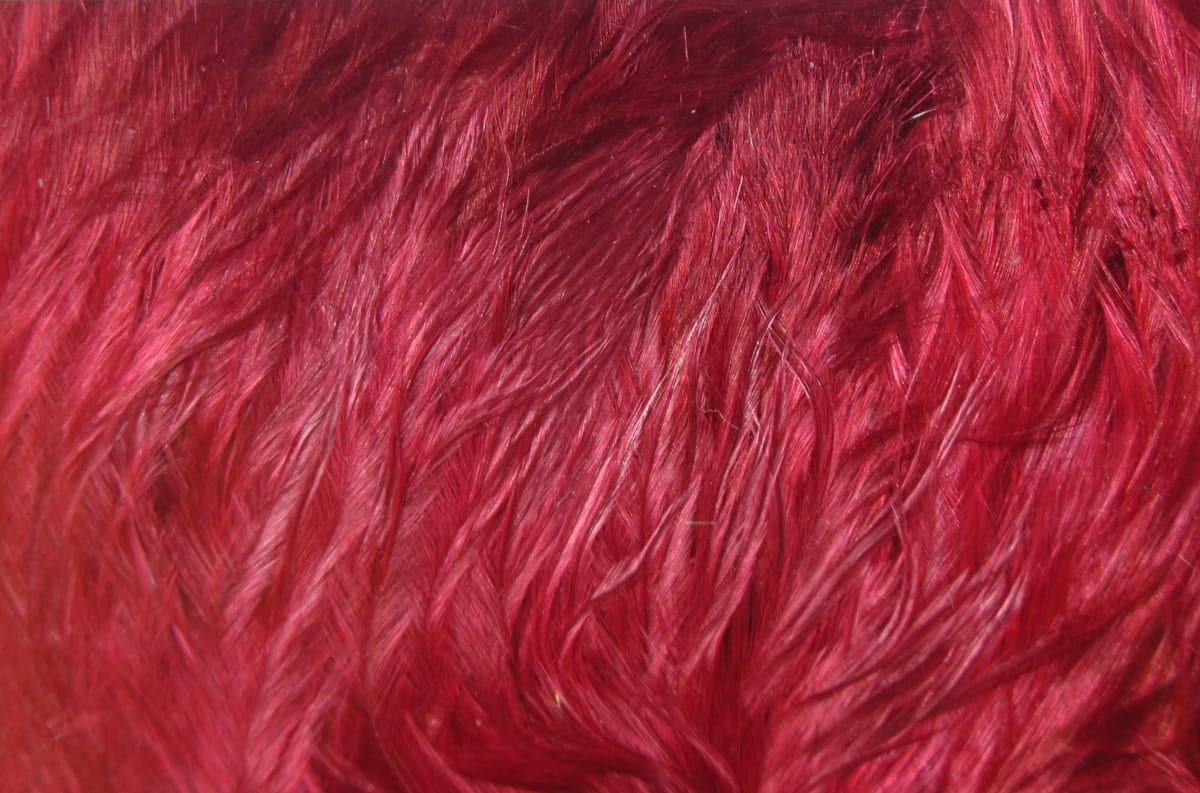 Deep red Hareline Woolly Bugger marabou feathers, soft silky plumes with long flowing fibers for fly tying