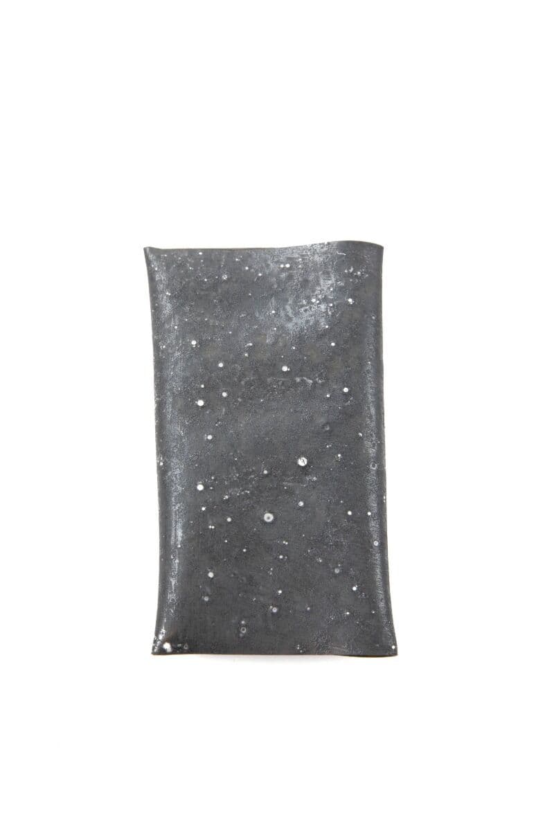 Kiley's Exo Skin dark gray flexible rubber sheet with scattered white speckle dots, glossy material for fly tying