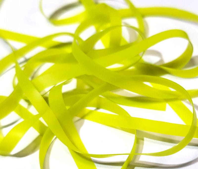 Chartreuse nymph skins: thin flat rubbery synthetic strips for fly tying, bright lime-green ribbon material
