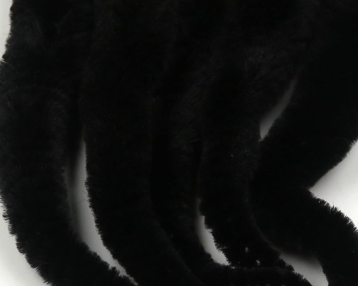 Black fuzzy chenille strands from Mangum's Mini Dragon Tails fly tying material, soft velvet-like synthetic tails