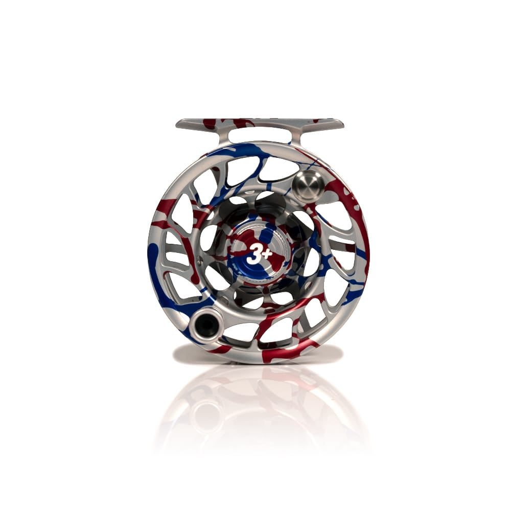 Silver machined Hatch Iconic 3+ fly reel with red, white and blue USA anniversary splash finish, open skeletal spool