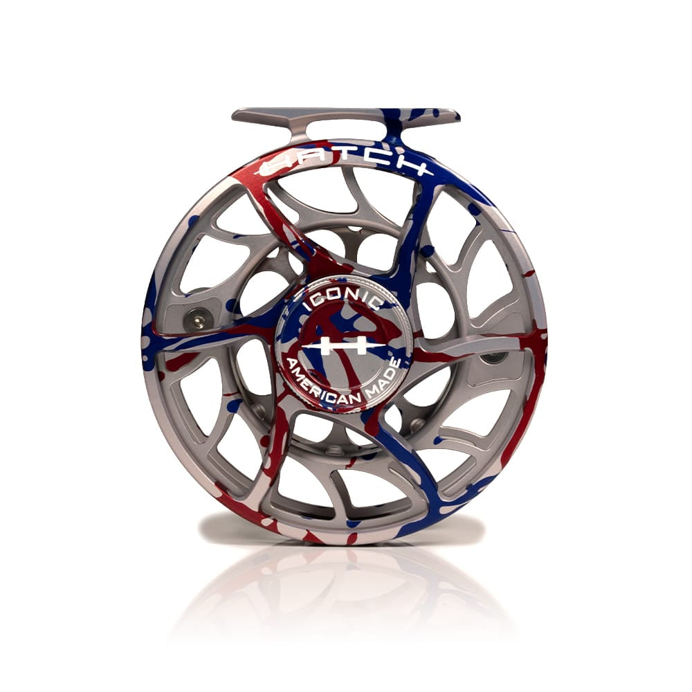 Hatch Iconic 250th anniversary fly reel in machined silver aluminum with red and blue splatter paint, open-frame design