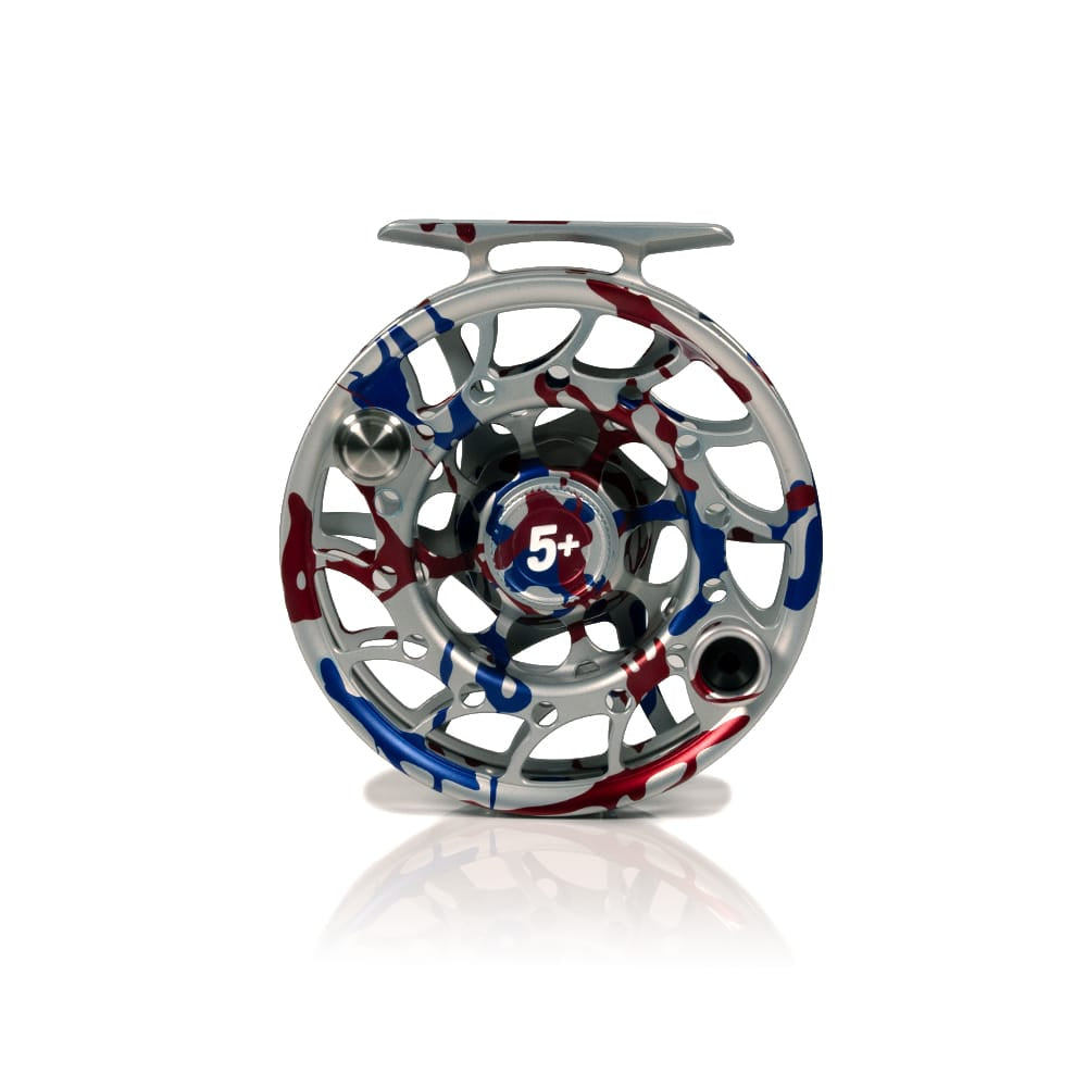 Silver machined aluminum Hatch 5+ fly reel with red, blue and white USA camo finish, open-frame design