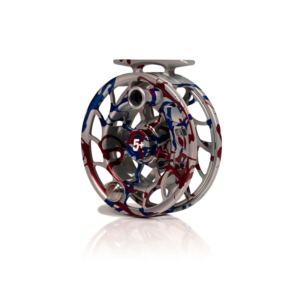 Hatch Iconic USA 250th fly reel in machined silver aluminum with red and blue patriotic splash and skeleton spool
