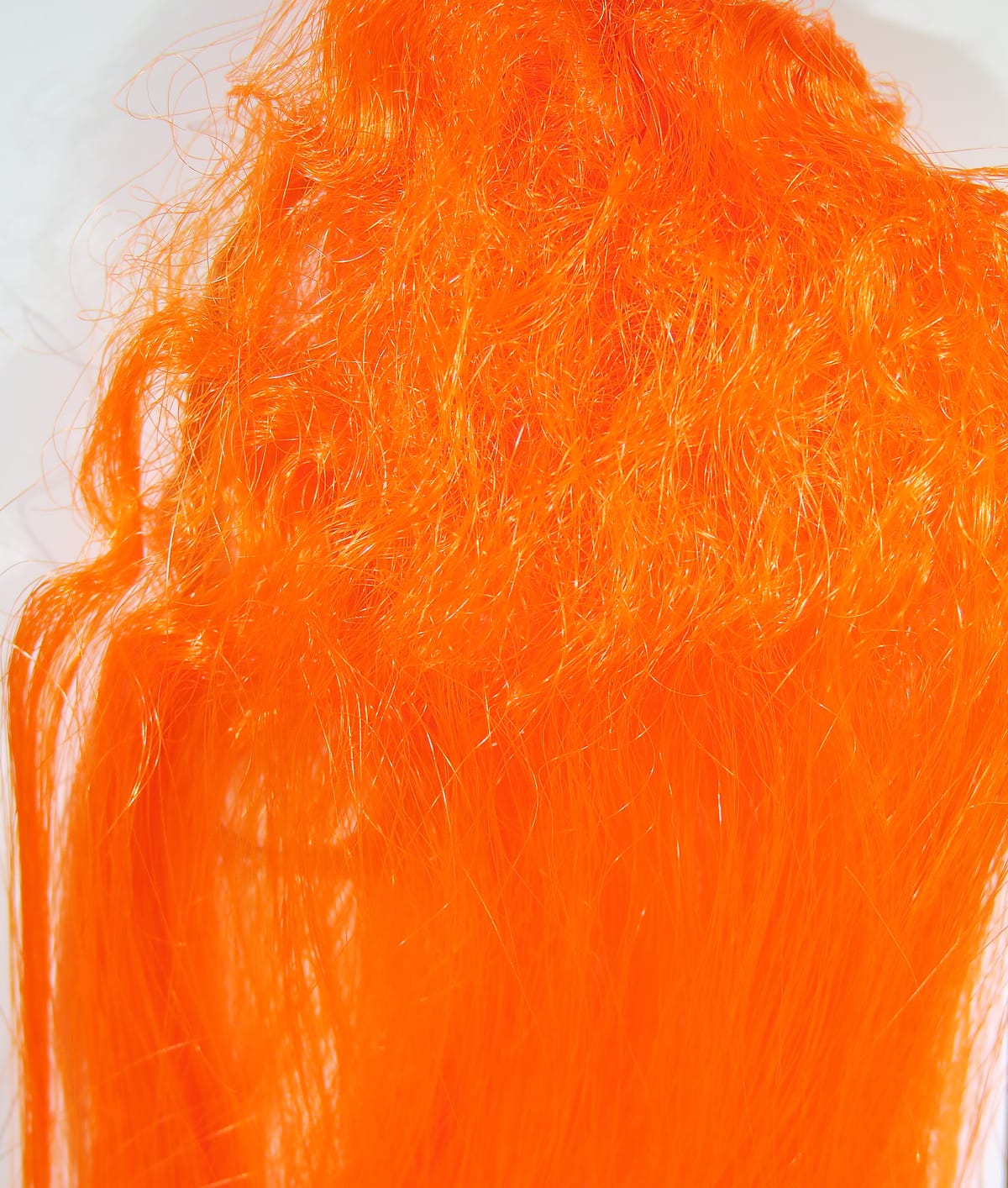 Hedron Big Fly Fiber in fluorescent orange, shimmering synthetic fly tying fibers with fluffy top and long silky strands