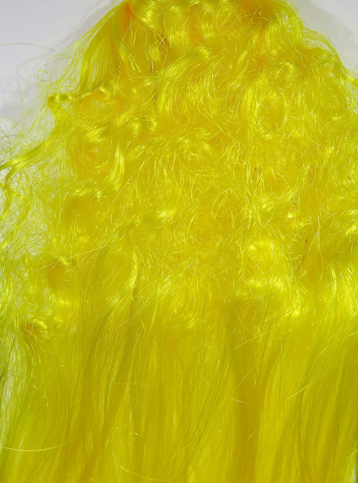 Bright chartreuse synthetic fiber for fly tying with glossy curly strands and long flowing texture by Hedron