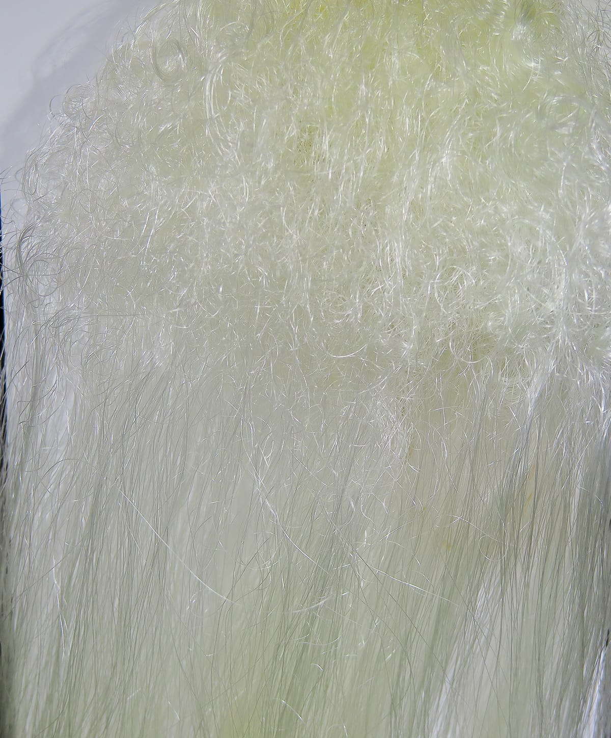 Pale ivory Hedron Big Fly fiber with curly, fluffy top and long glossy synthetic strands for fly tying