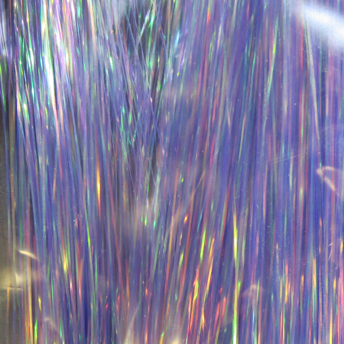 Iridescent purple dyed pearl Flashabou strands with holographic green and pink flashes, fly tying tinsel material