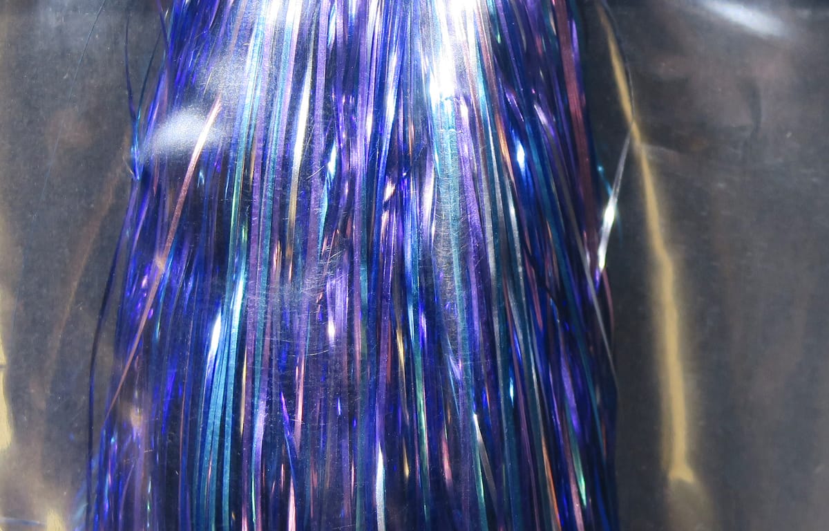Iridescent blue-purple Hedron Flashabou tinsel strands, shiny reflective synthetic material for fly tying and lures