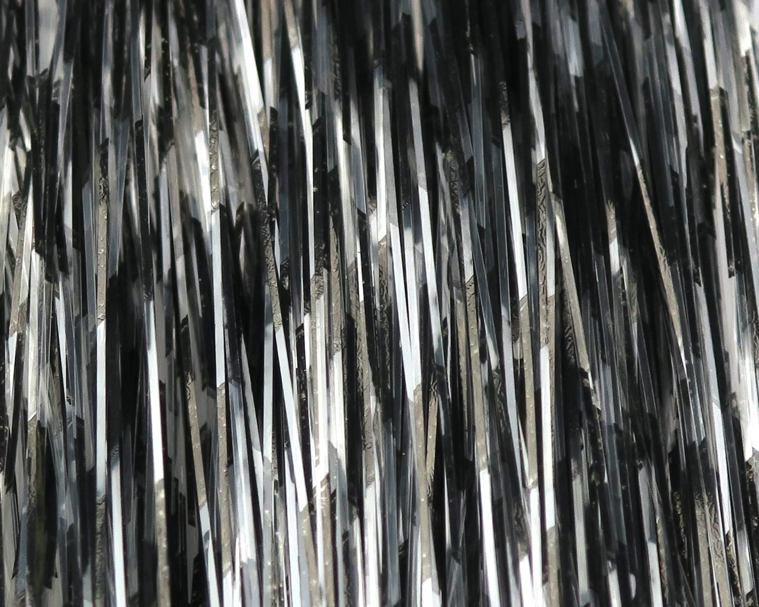Hedron Grizzly-Barred Flashabou black and silver reflective synthetic strands for fly tying, thin barred tinsel strips