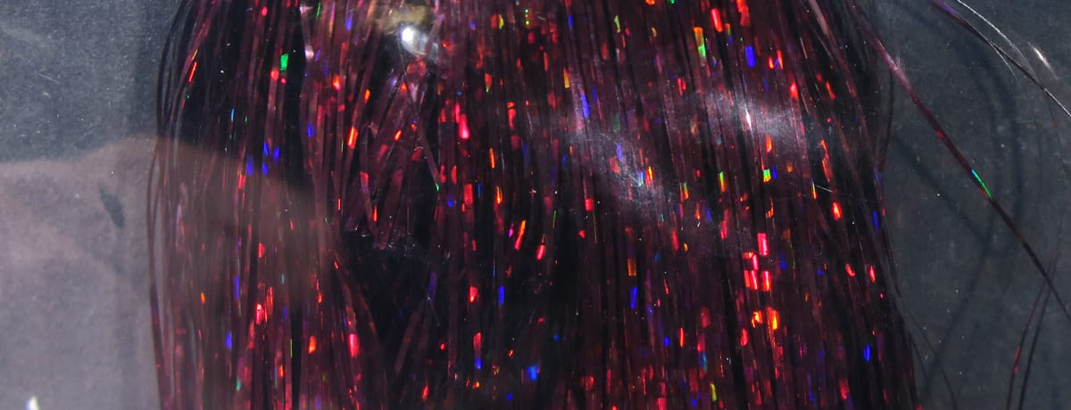 Hedron holographic Flashabou deep red strands with multicolor reflective flakes, shiny tinsel material for fly tying