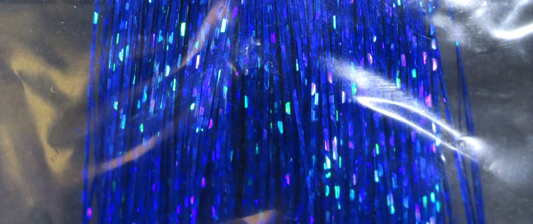 Holographic blue Flashabou strands with iridescent purple and aqua flashes, synthetic tinsel for fly tying