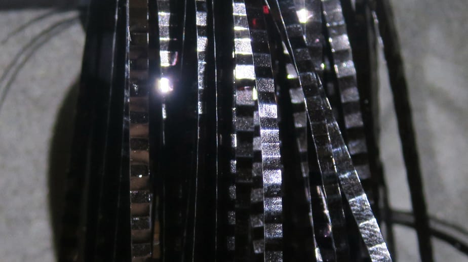 Black metallic Hedron lateral scale strips with reflective silver facets, segmented flash material for fly tying