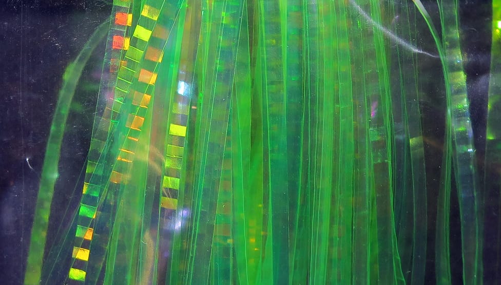 Hedron lateral scale fly tying material: translucent green holographic thin strips with square reflective accents