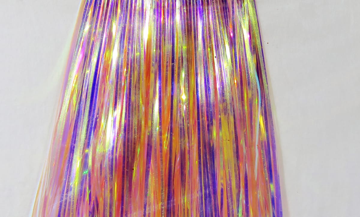 Hedron Mirage Flashabou strands in iridescent pink, purple and gold holographic tinsel for fly tying