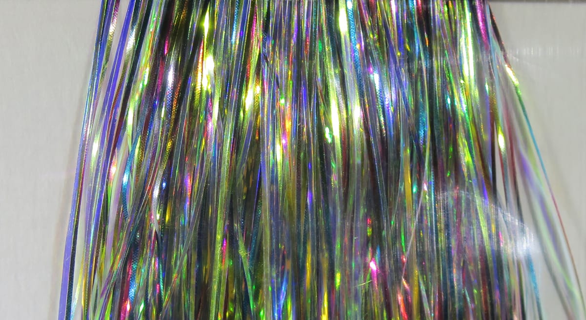 Hedron Mirage Flashabou holographic strands - iridescent rainbow tinsel in greens, purples and gold for fly tying