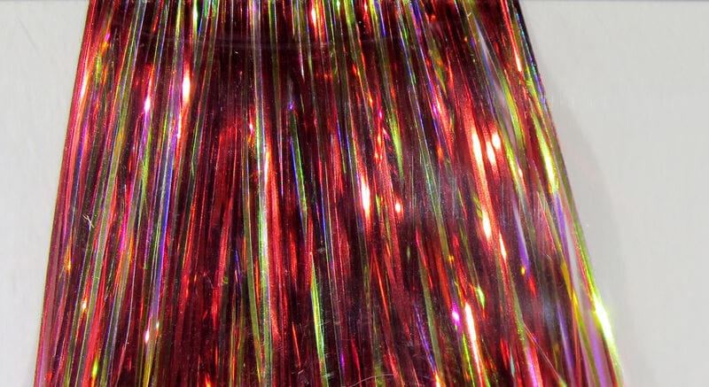 Red Hedron Mirage Flashabou strands with iridescent green and gold reflections, thin holographic tinsel for fly tying