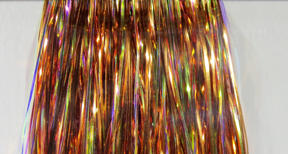 Hedron Mirage Flashabou copper-gold holographic tinsel strands for fly tying, iridescent reflective flash material