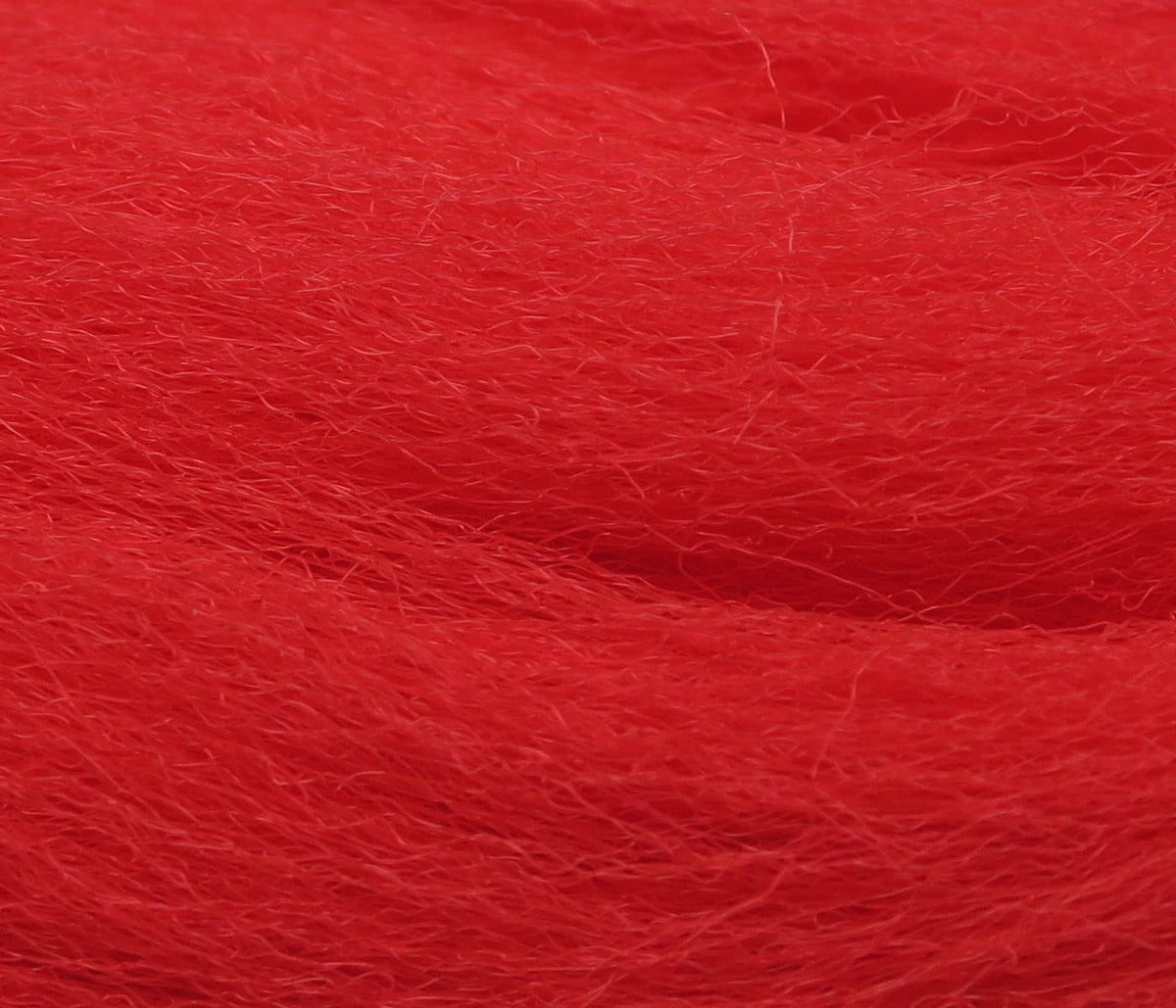 Bright red Hedron Neer synthetic hair for fly tying, fine fluffy fibers with soft, tapered texture