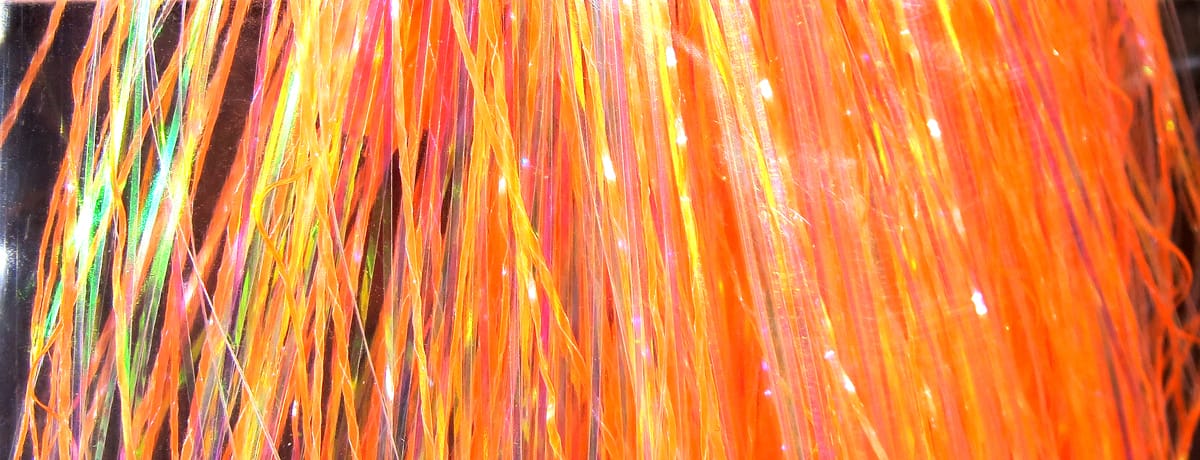 Pearl A Glow Flashabou orange iridescent synthetic strands with pearlescent shimmer for fly tying