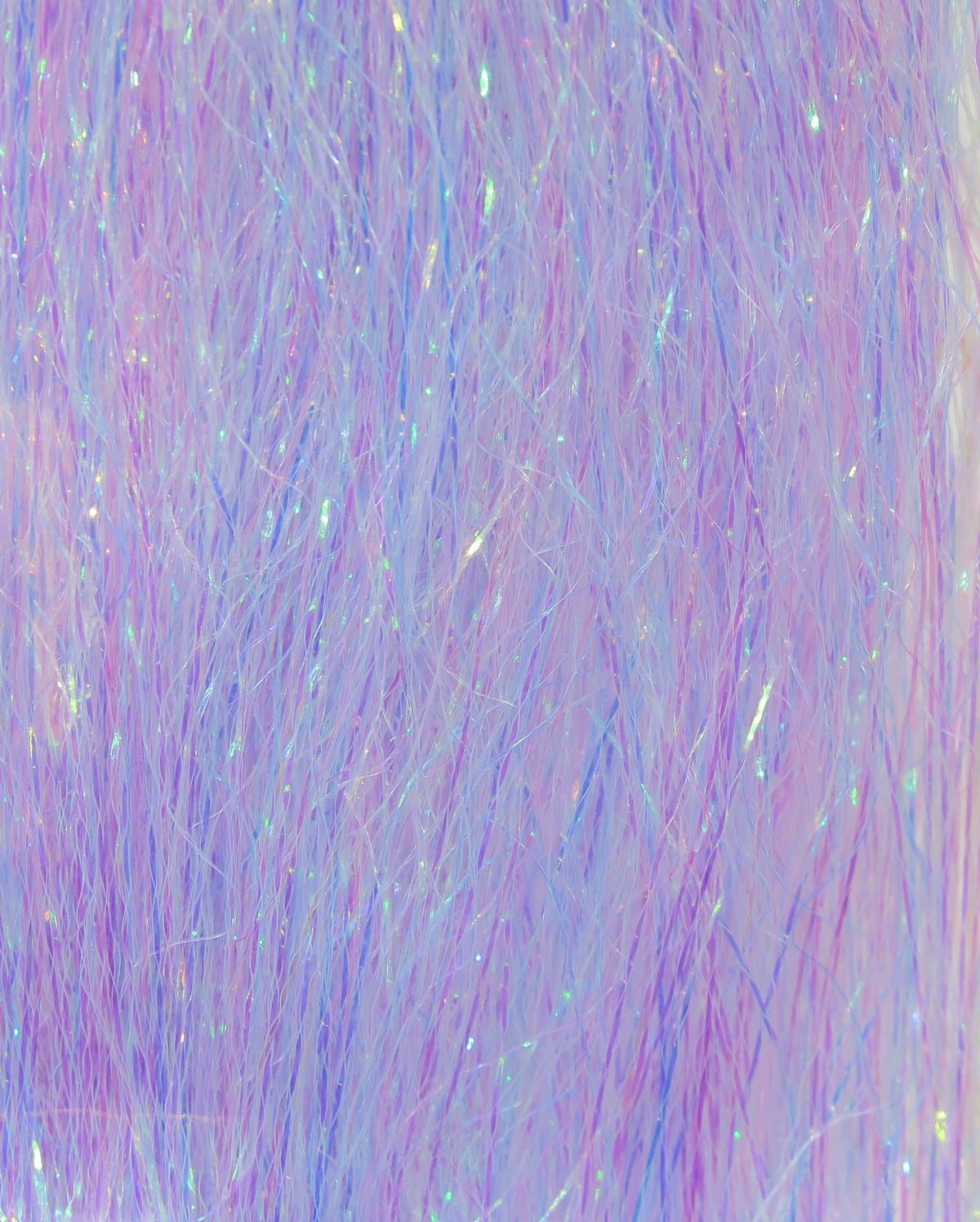 Hedron Polarflash iridescent fly tying fiber in pastel pink and lavender with holographic sparkles and fine synthetic strands