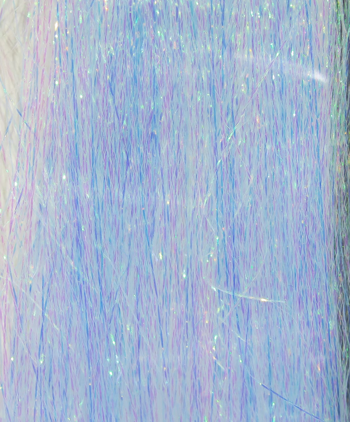 Iridescent pastel blue-violet synthetic fibers with holographic sparkle, Hedron Polarflash fly tying material