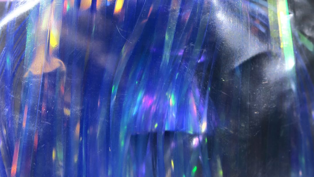 Iridescent cobalt-blue Hedron Saltwater Flashabou with holographic purple and green flashes, reflective fly-tying tinsel