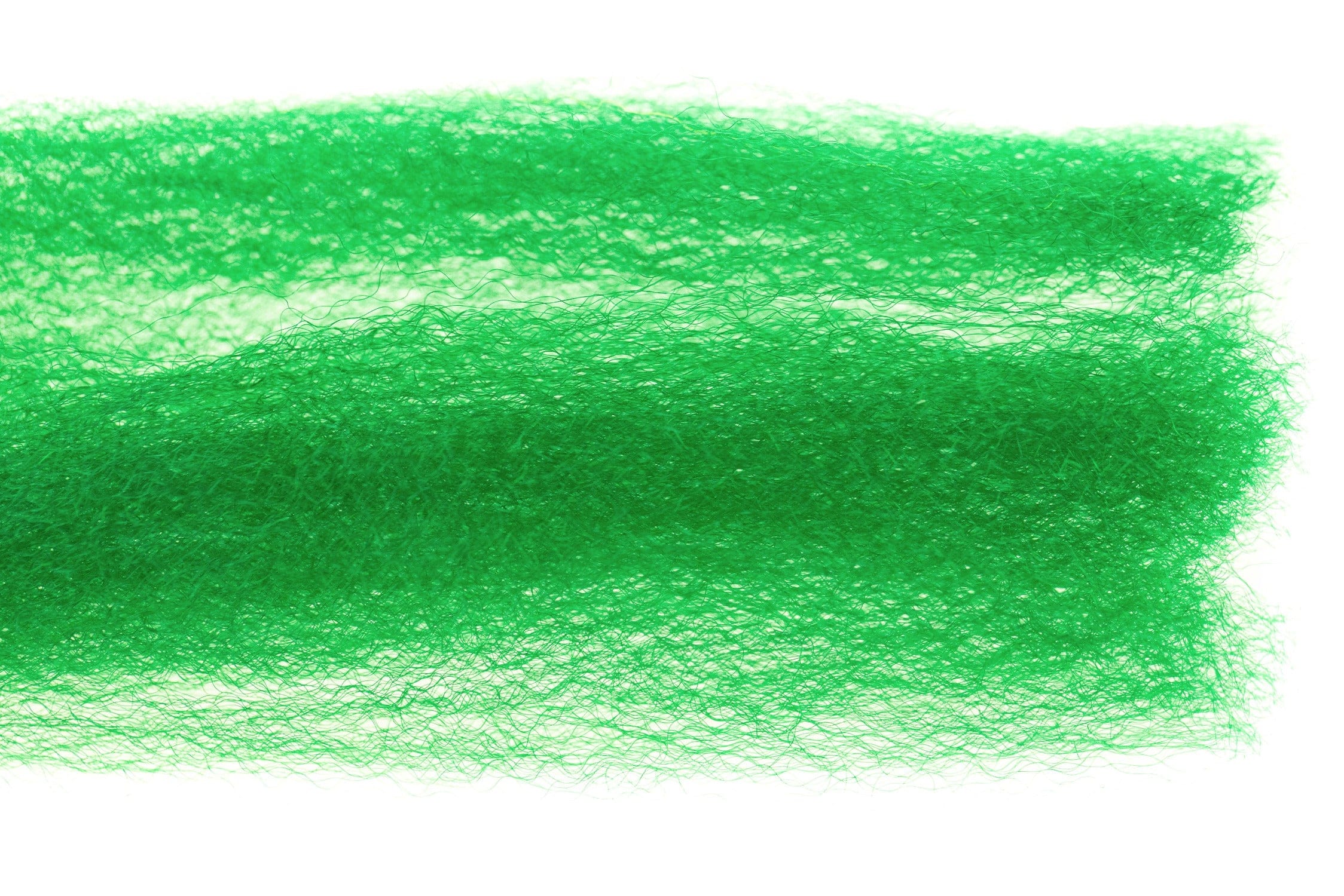 Bright emerald green Hedron strung fuzzy fiber with wispy synthetic strands in layered mats for fly tying