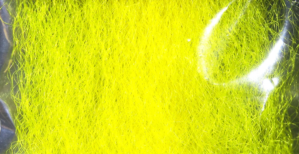 Bright chartreuse Hedron strung fuzzy fiber with fine wispy synthetic strands for fly tying