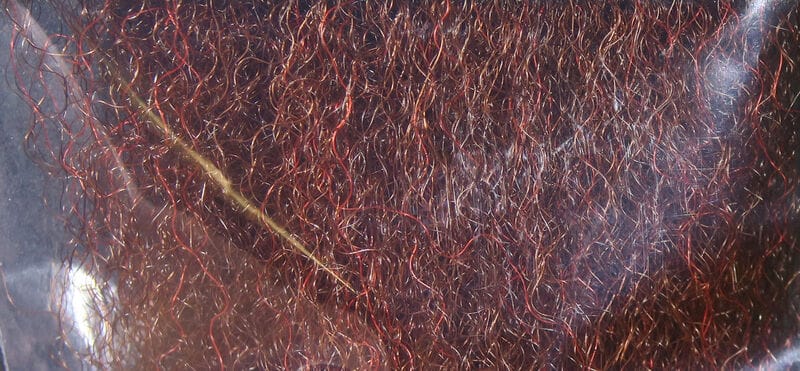 Hedron strung fuzzy fiber for fly tying, dense copper-red and brown synthetic fibers with shimmering metallic red strands
