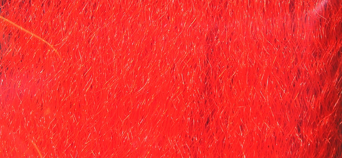 Bright red Hedron strung fuzzy fiber with fine iridescent synthetic strands for fly tying