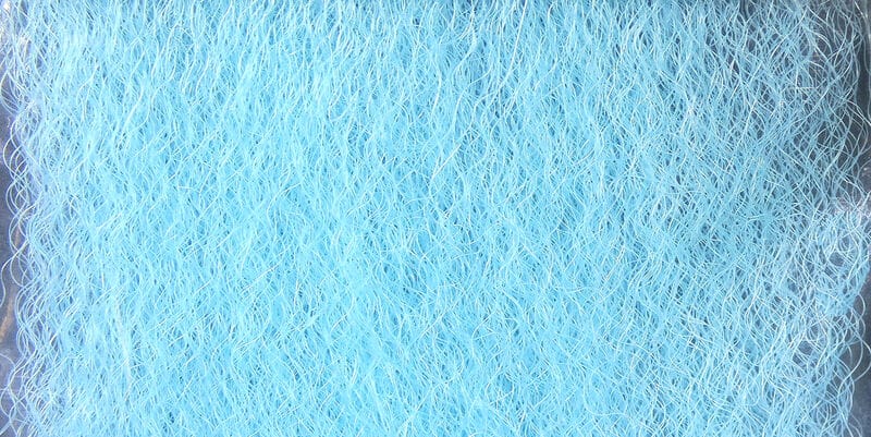 Hedron strung fuzzy fiber in pale blue, wispy tangled synthetic strands for fly tying, soft textured dubbing material