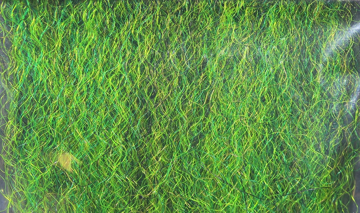 Hedron strung fuzzy fiber in bright green and chartreuse, thin curly synthetic strands for fly tying