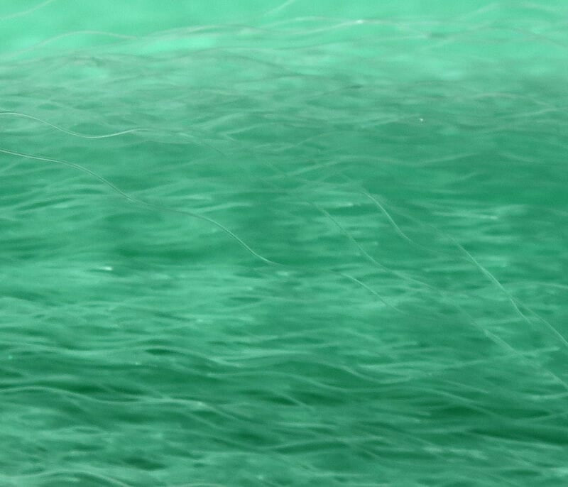Green Hedron Supreme Super Hair synthetic fly tying fibers — long translucent glossy strands with soft flowing texture