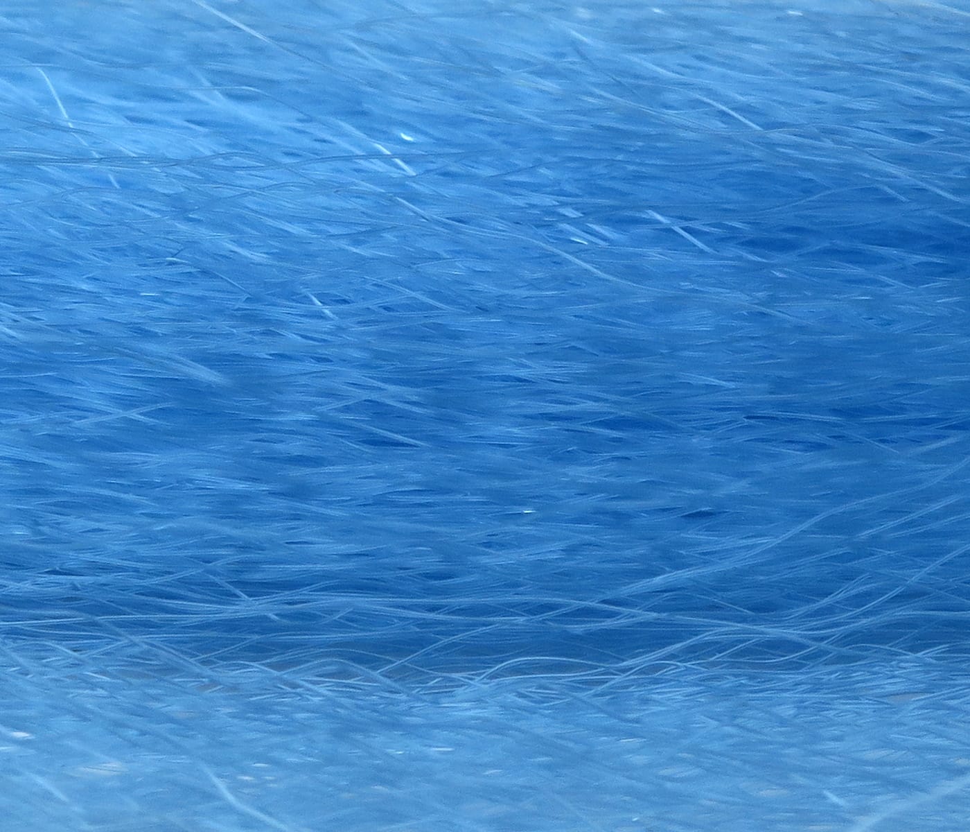 Hedron Supreme Super Hair bright blue synthetic fly tying fibers, wispy long strands with glossy textured finish
