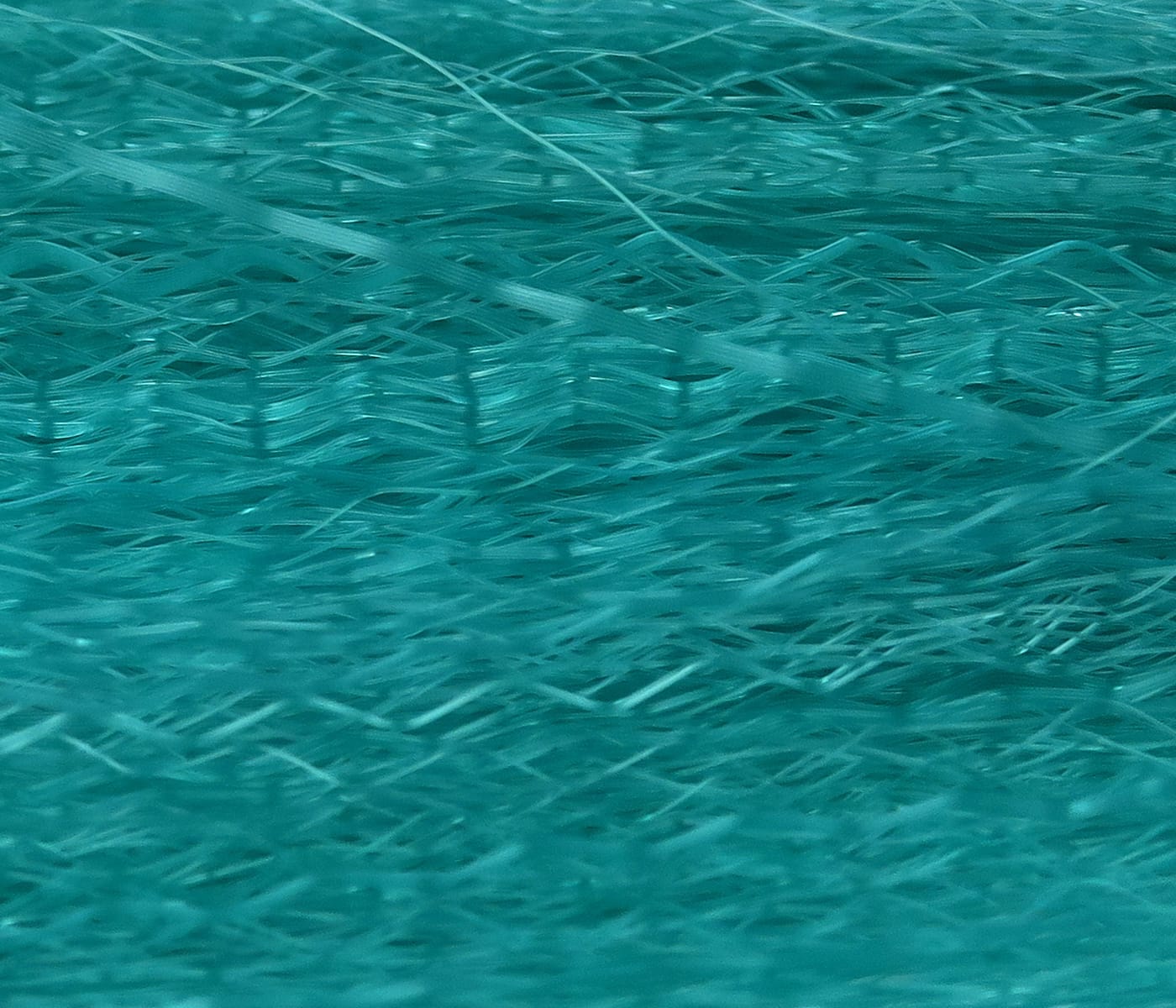 Teal Hedron Unique Hair synthetic fly tying fibers with fine, wavy, glossy layered strands