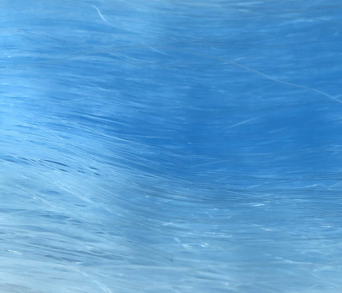 Hedron sky-blue synthetic hair fibers with long wispy strands and glossy sheen for fly tying