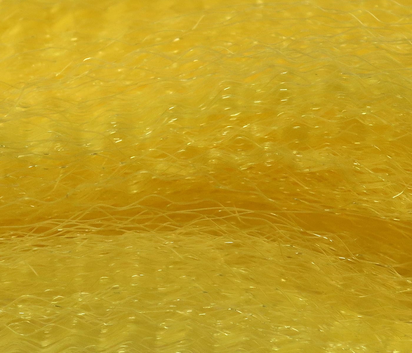 Chartreuse-yellow Hedron Unique Hair synthetic fibers with fine wavy strands and subtle iridescent flash for fly tying
