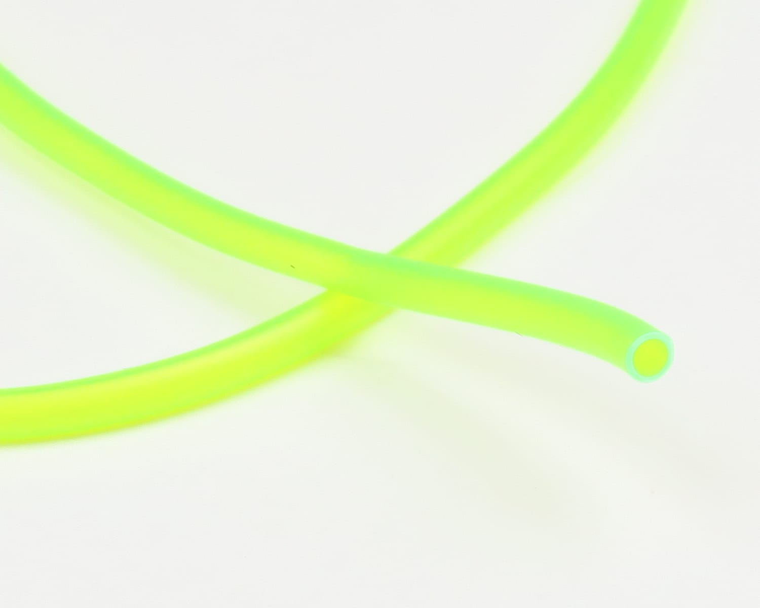 Neon chartreuse HMH hook holder tubing for fly tying, flexible hollow plastic tube crossed with visible open end