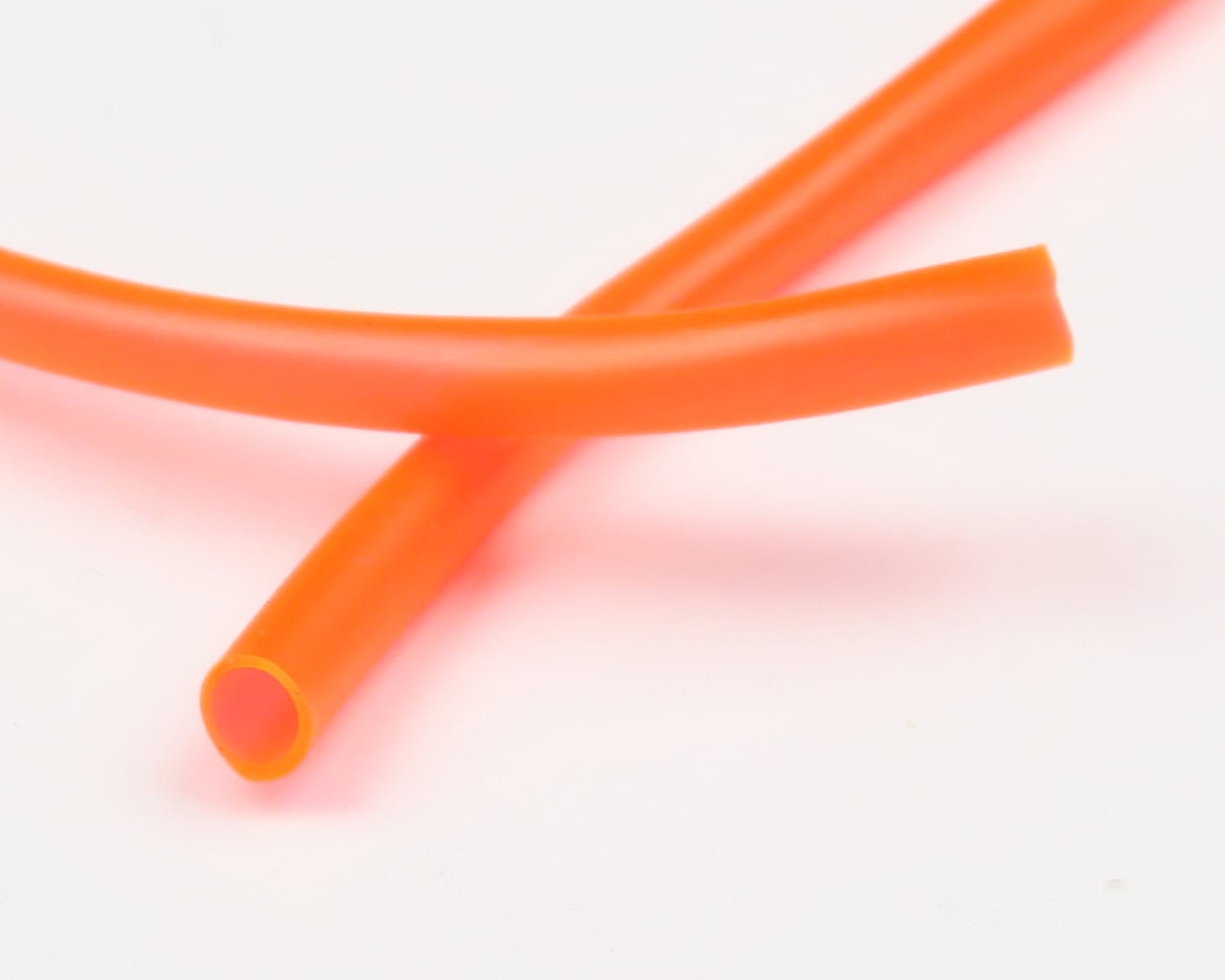 Bright orange flexible hollow tubing, smooth plastic HMH hook holder for fly tying