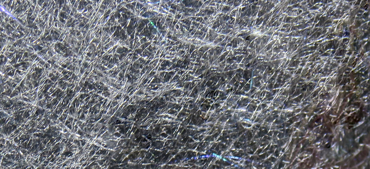 Silver-gray Hareline Jr. Bruiser Blend fly tying dubbing with fine synthetic fibers and iridescent flash