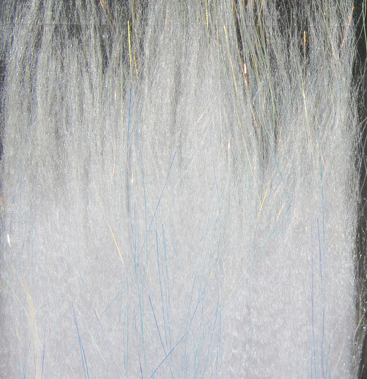 White iridescent Angel Silk synthetic fibers with fine shimmering blue and gold flash for fly tying material