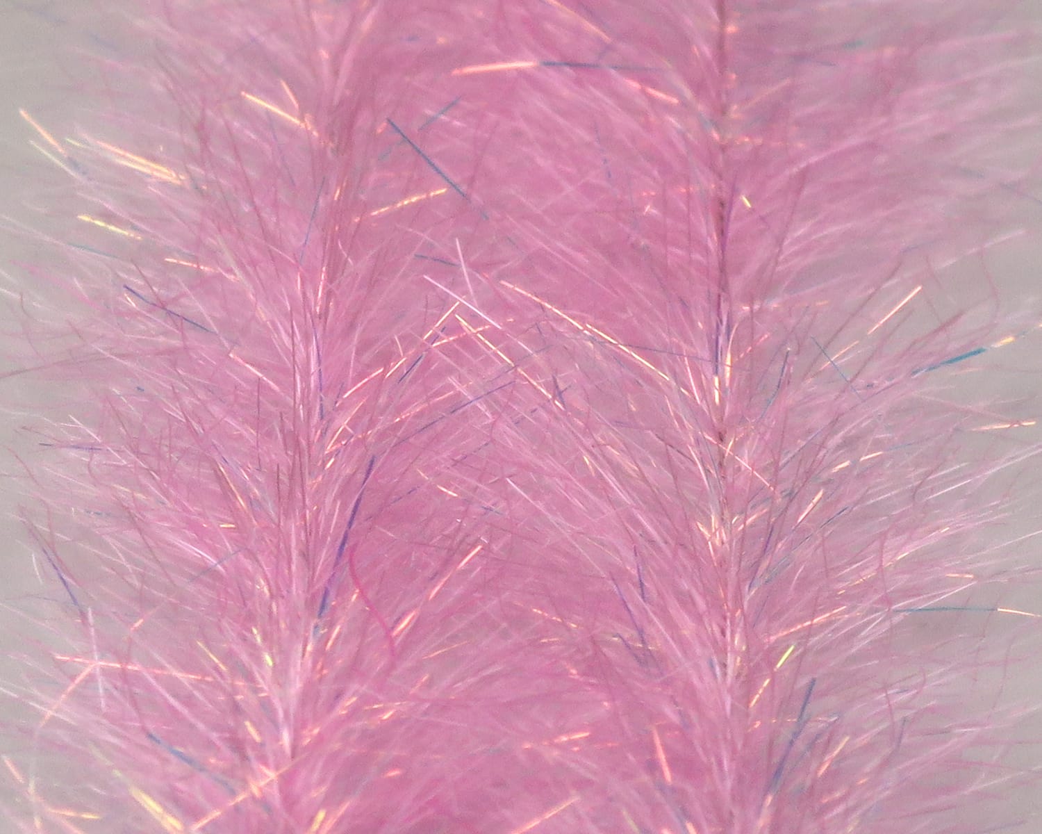 Pink iridescent synthetic fibers, fluffy baitfish brush for fly tying with fine flashy strands